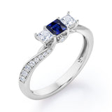 Scale Bridge Accent 0.65 carat Princess Blue Sapphire and Moissanite Twisted Wave Engagement Ring in Rose Gold