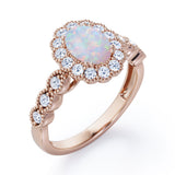Vintage Floral Halo 0.7 carat Oval and Round Opal and diamond Engagement Ring in Rose Gold