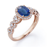 Twisted 1.45 Carat Oval Cut Sapphire And Diamond Halo Engagement Ring In White Gold