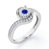 Wrapped Round 0.65 carat Round Blue Sapphire and Moissanites Bypass Engagement Ring in White Gold
