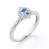 1.15 Carat Round Cut Aquamarine And Diamond Halo Engagement Ring In White Gold
