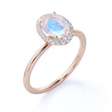 Antique 1.25 Carat Oval Cabochon Cut Blue Moonstone and Diamond Halo Engagement Ring in White Gold
