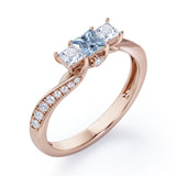 Scale Bridge Accent 0.65 carat Princess Aquamarine and Moissanite Twisted Wave Engagement Ring in Rose Gold