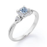 Prong and Halo 0.6 carat Princess Aquamarine and Moissanite Twisted Shank Engagement Ring in White Gold