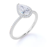 1.50 Carat Pear Cut Moissanite and Diamond Halo Engagement Ring in White Gold