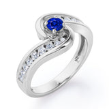 Spinning 0.7 carat Round Blue Sapphire and Moissanite Channel Engagement Ring in White Gold