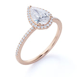 1.50 Carat Pear Cut Moissanite and Diamond Halo Engagement Ring in White Gold