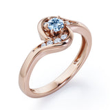 Whirly Gemstone 0.55 carat Round Aquamarine and Moissanites Artistic Engagement Ring in Rose Gold
