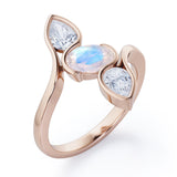 Distorted Line Three Stone 1 carat Oval and Pear Moonstone and moissanite Ring in Rose Gold