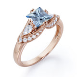 Vintage Eight Prongs 1.30 Carat Princess Cut Aquamarine And Diamond Marquise Framed Beaded Engagement Ring In White Gold