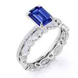 Unique Prong Set 2.25 Carat Emerald Cut Sapphire and Diamond Pave Bridal Set with Eternity Band in White Gold