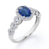 Twisted 1.45 Carat Oval Cut Sapphire And Diamond Halo Engagement Ring In White Gold