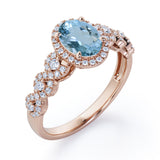 Twisted 1.45 Carat Oval Cut Aquamarine And Diamond Halo Engagement Ring In White Gold
