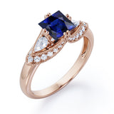 Vintage Eight Prongs 1.30 Carat Princess Cut Sapphire And Diamond Marquise Framed Beaded Engagement Ring In Rose Gold