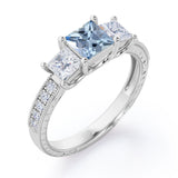 Trilogy 1.25 Carat Princess Cut Aquamarine And Diamond Three Stone Vintage Milgrain Engagement Ring In Rose Gold