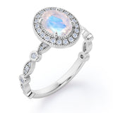 Antique Art Deco 1.35 Carat Oval Cut Moonstone And Diamond Halo Engagement Ring In White Gold