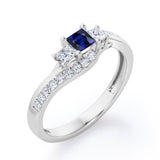 Trellis Three Stones 1 carat Princess Blue Sapphire and Moissanites Braided Engagement Ring in White Gold