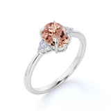 Prong Set 1.20 Carat Oval Cut Morganite and Six Stone Diamond Engagement Ring in Rose Gold