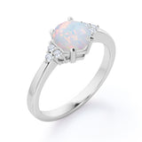 Seven Stone 1.25 Carat Round Cut Natural Opal And Diamond Tapered Engagement Ring In White Gold.
