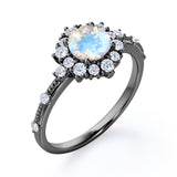 Snowflake Inspired 0.6 carat Round Moonstone and Moissanite Engagement Ring in Black Gold