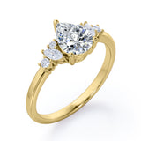 Fashionable 7 Stones 0.6 carat Pear Moissanite and Diamond Engagement Ring in Rose Gold