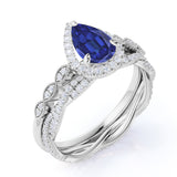 Antique Pave Set 2.25 Carat Pear Cut Sapphire and Diamond Halo Bridal Set with Infinity Band in White Gold