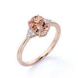 Prong Set 1.20 Carat Oval Cut Morganite and Six Stone Diamond Engagement Ring in Rose Gold
