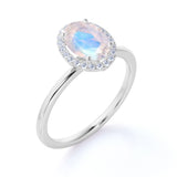 Antique 1.25 Carat Oval Cabochon Cut Blue Moonstone and Diamond Halo Engagement Ring in White Gold