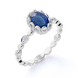 Vintage Art Deco 1.15 Carat Oval cut Blue Lab-Created Sapphire and Diamond Bezel Engagement Ring