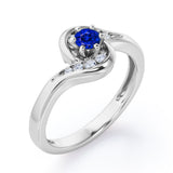 Whirly Gemstone 0.55 carat Round Blue Sapphire and Moissanites Artistic Engagement Ring in White Gold