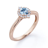 1.15 Carat Round Cut Aquamarine And Diamond Halo Engagement Ring In White Gold