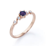 Classic Six Prong 1.10 Carat Round Cut Lab Created Alexandrite And Diamond Five Stone Engagement Ring In White Gold.