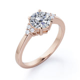 Tapered Classic 0.55 carat Round Moissanite and Diamond Engagement Ring in White Gold