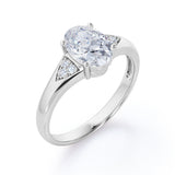Tapered Shank 7 Stone 1.35 Carat Oval Cut Moissanite and Diamond Prong Basket Engagement Ring in White Gold
