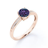 Simple Four Prong 1.25 Carat Round Cut Lab Created Alexandrite And Diamond Channel Set Engagement Ring In White Gold