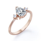 Minimalist Three Stone 0.55 carat Pear Moissanite and Diamond Engagement Ring in Rose Gold