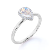Elegant 1.25 Carat Pear Blue Moonstone and Diamond Pave Engagement Ring in Rose Gold