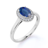 Antique Milgrain 1.25 Carat Oval cut Sapphire and Diamond Halo Engagement Ring in White Gold