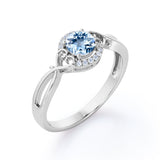 Modern Halo 1.50 Carat Round Cut Vivid Blue Aquamarine and Diamond Heart Twist Engagement Ring