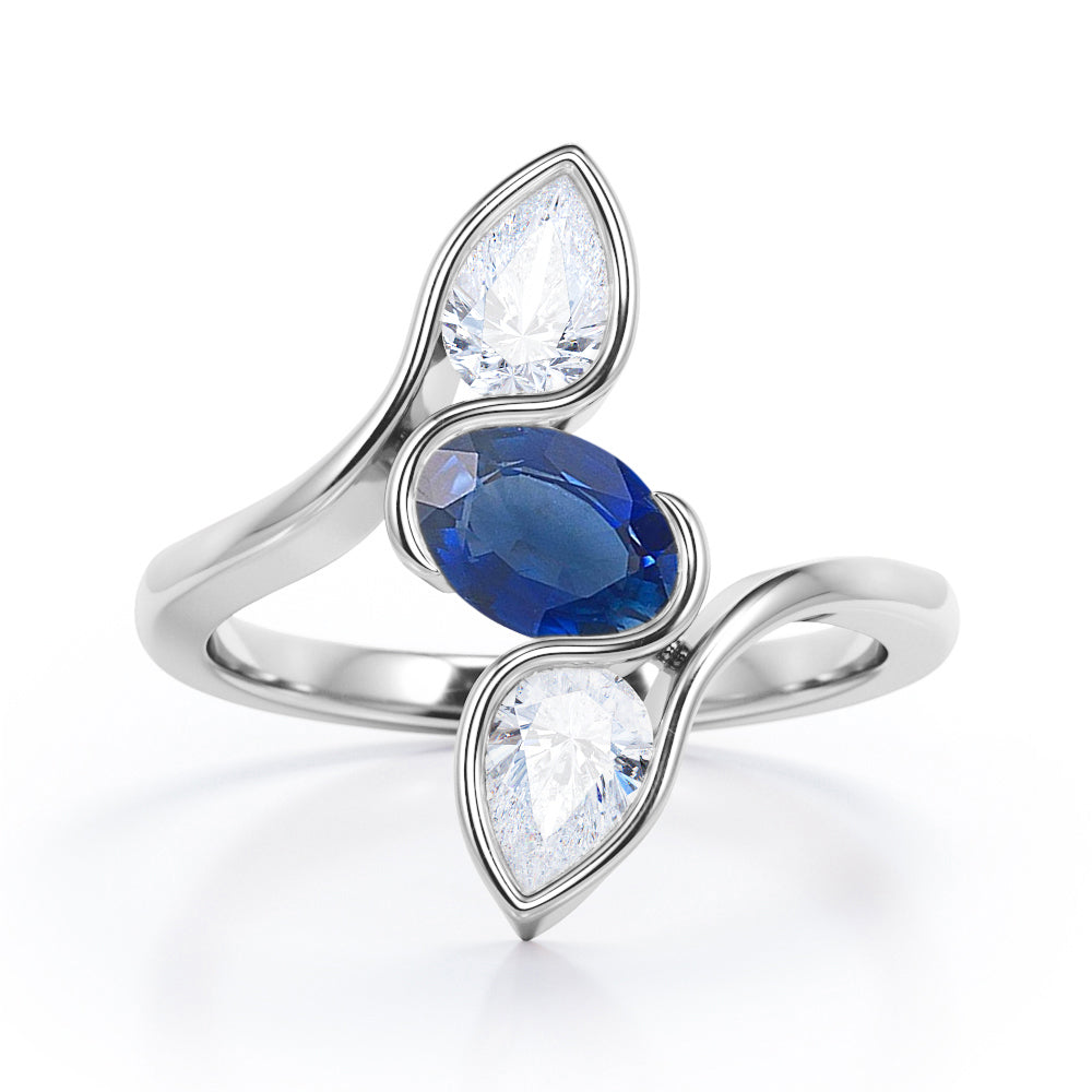 Distorted Line Three Stone 1 carat Oval and Pear Blue Sapphire and moissanite Ring in Rose Gold