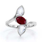 Distorted Line Three Stone 1 carat Oval and Pear Lab Ruby and moissanite Ring in Rose Gold