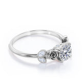 Sophisticated Roses 0.55 carat Round Moissanite Engagement Ring in Rose Gold