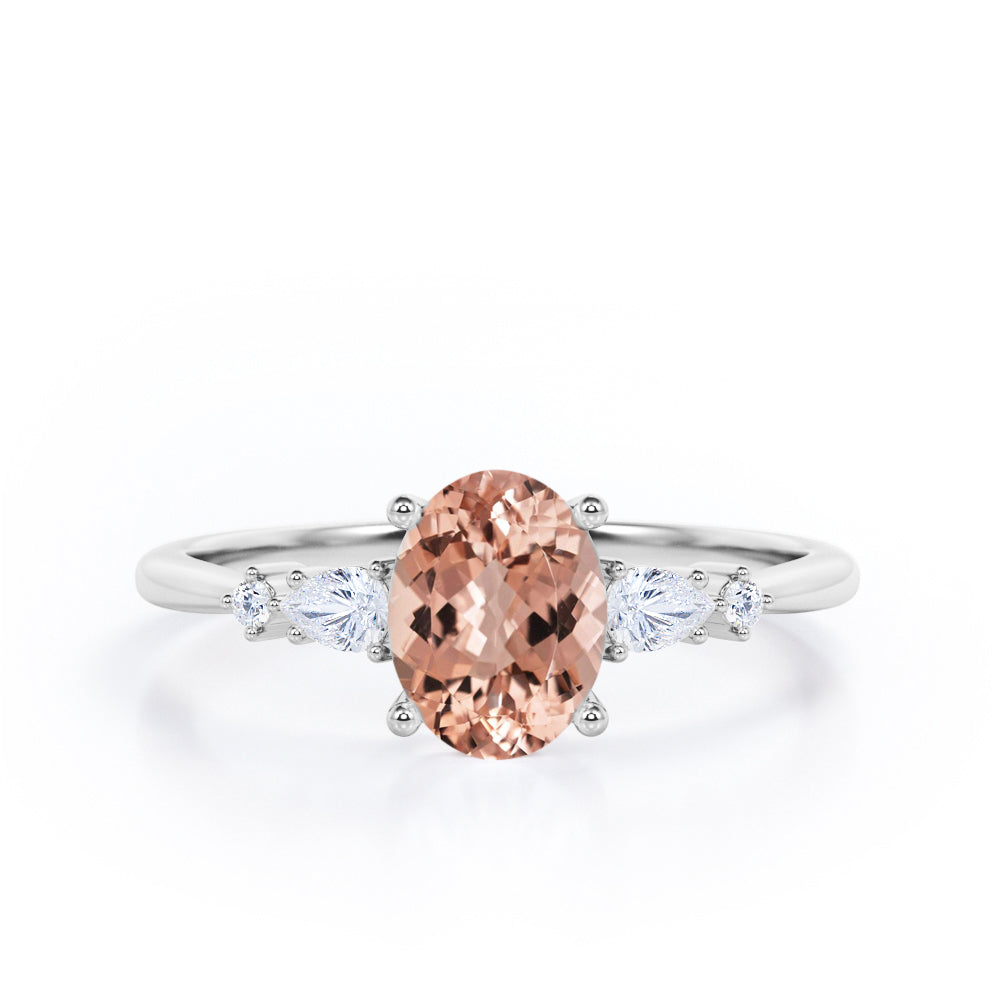 Classic Five Stone 0.6 carat Oval Morganite and Diamond Engagement Ring in Rose Gold