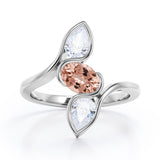 Distorted Line Three Stone 1 carat Oval and Pear Morganite and moissanite Ring in Rose Gold