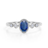 Antique 1.25 Carat Oval cut Sapphire and Diamond Halo Engagement Ring in White Gold