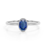 Plain Shank 1.25 Carat Oval Cut Sapphire and Diamond Halo Engagement Ring in White Gold