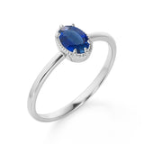 Plain Shank 1.25 Carat Oval Cut Sapphire and Diamond Halo Engagement Ring in White Gold