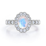 Vintage Floral Halo 0.7 carat Oval and Round Moonstone and diamond Engagement Ring in Rose Gold