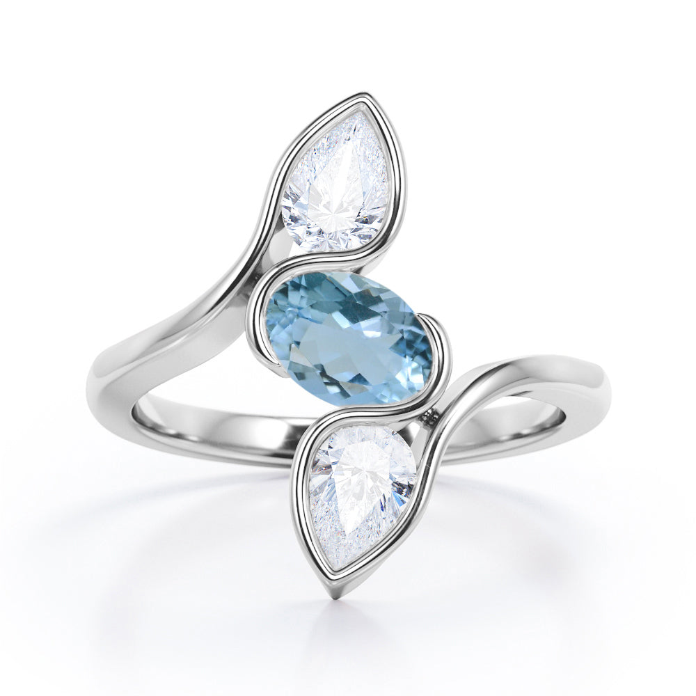 Distorted Line Three Stone 1 carat Oval and Pear Aquamarine and moissanite Ring in Rose Gold