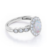 Vintage Floral Halo 0.7 carat Oval and Round Opal and diamond Engagement Ring in Rose Gold